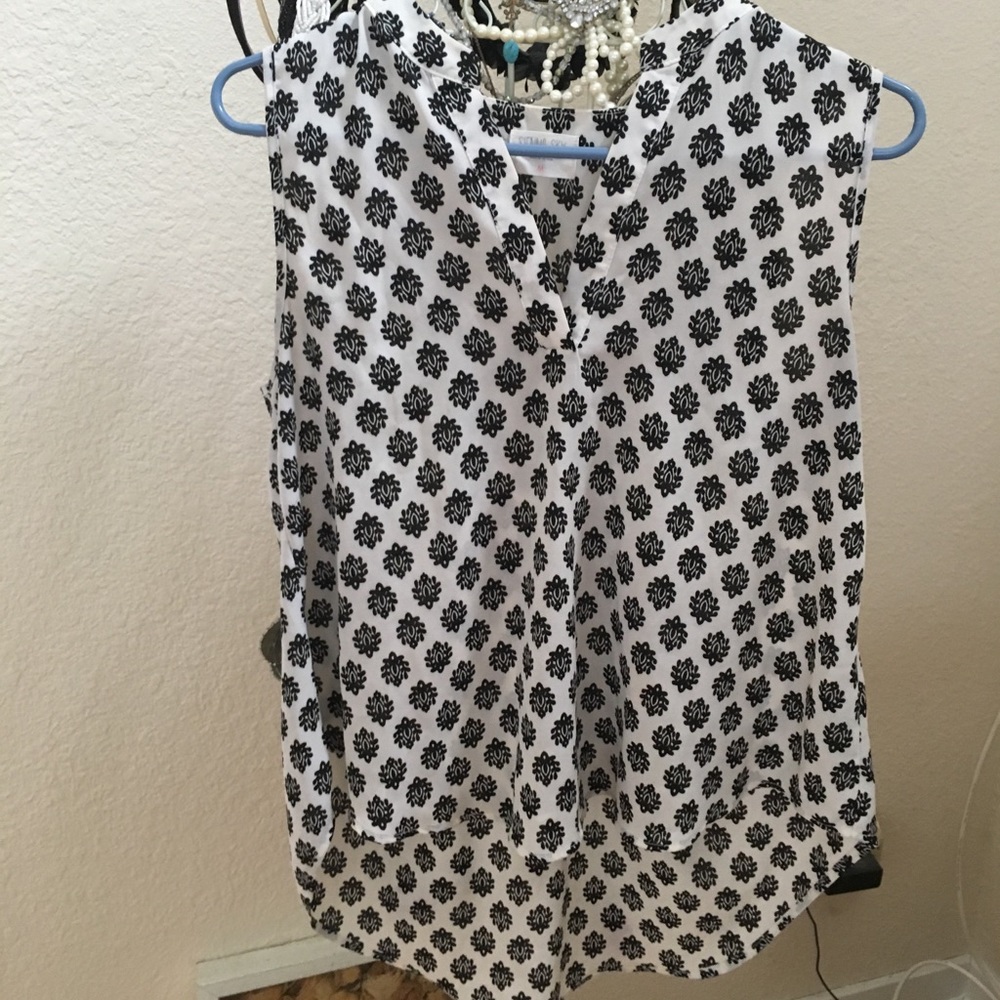Beautiful sleeveless Print blouse by Sienna Sky!